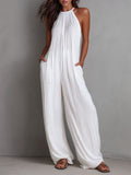 Elena | Mono fluido elegante con cuello halter