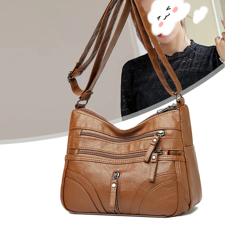 Clara - Bolso bandolera moderno con múltiples cremalleras y correa ajustable
